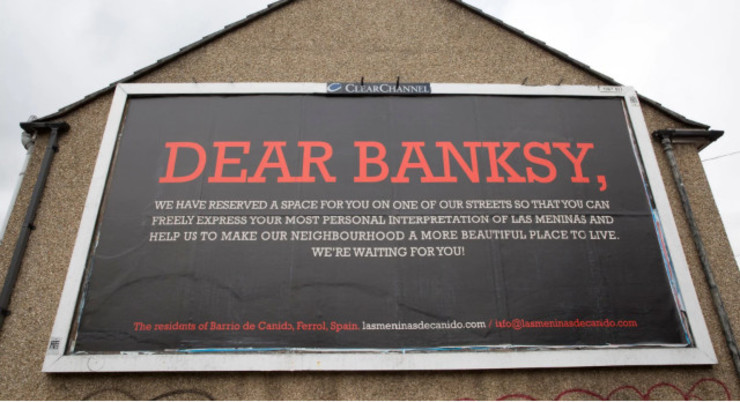 Valado coa publicidade para chamar a atención de Banksy 